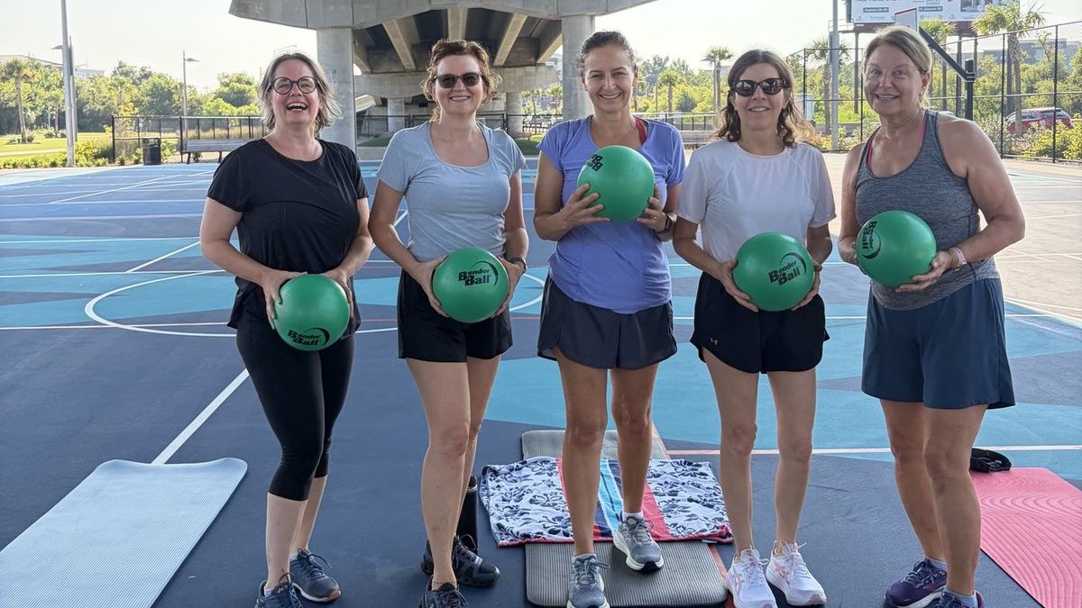 Bloom50 members after a class on the courts beneath the Ravenel Bridge